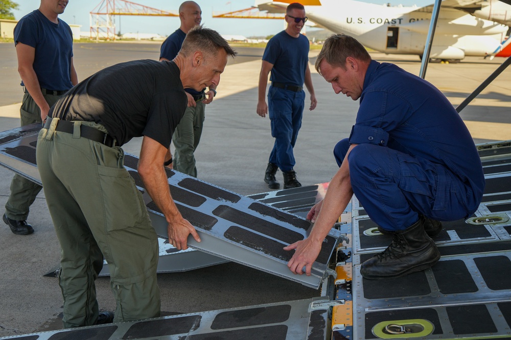 U.S. Coast Guard Air Station Barbers Point and U.S. Coast Guard Aids to Navigation Team Honolulu prepare a flight to Maui