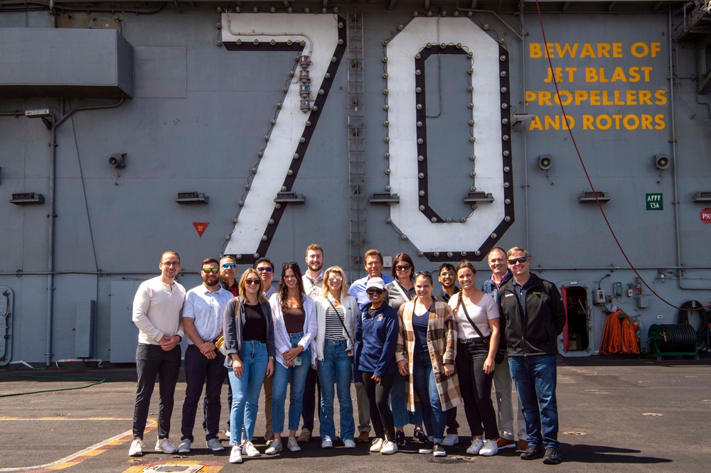 Members of Deloitte Counseling take a tour of Nimitz-class aircraft carrier USS Carl Vinson (CVN 70)