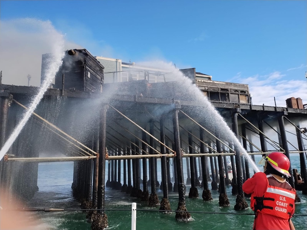Firemen aboard Coast Guard Cutter Sea Otter Fight Oceanside Pier Fire in San Diego