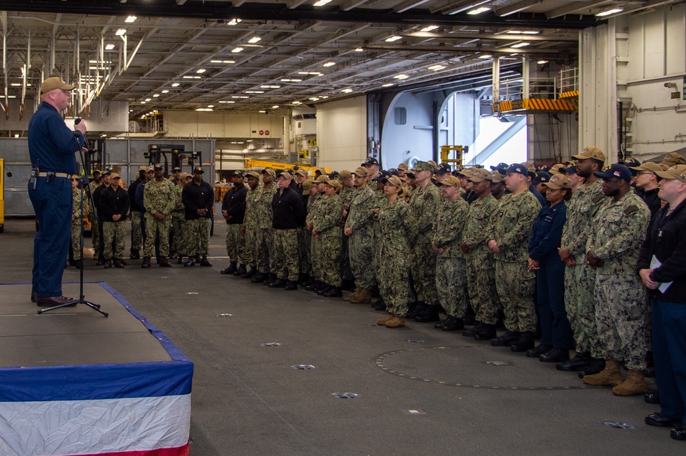 USS Ronald Reagan (CVN 76) Sailors have morning quarters with the commanding officer