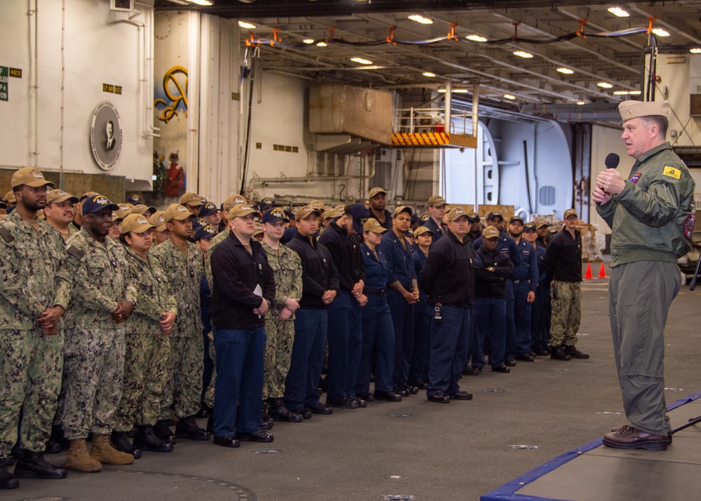 USS Ronald Reagan (CVN 76) Sailors have morning quarters with the commanding officer