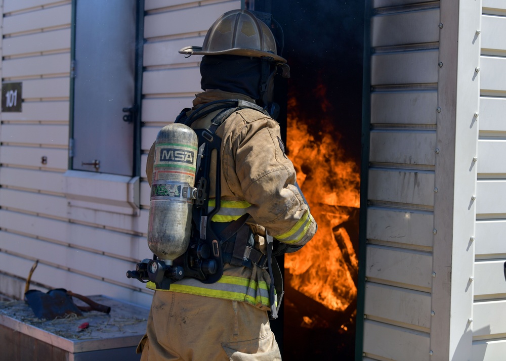 104th Fighter Wing firefighters are tested during a live fire training.