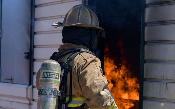 104th Fighter Wing firefighters are tested during a live fire training.