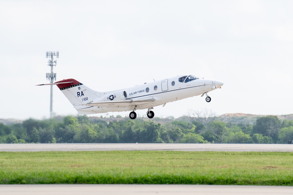 T-1 Jayhawk Memorializing Maj. Jeff Ausborn flys to the Boneyard
