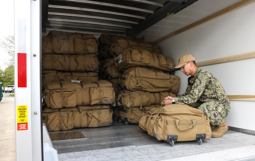 U.S. Navy sailors return deployment gear