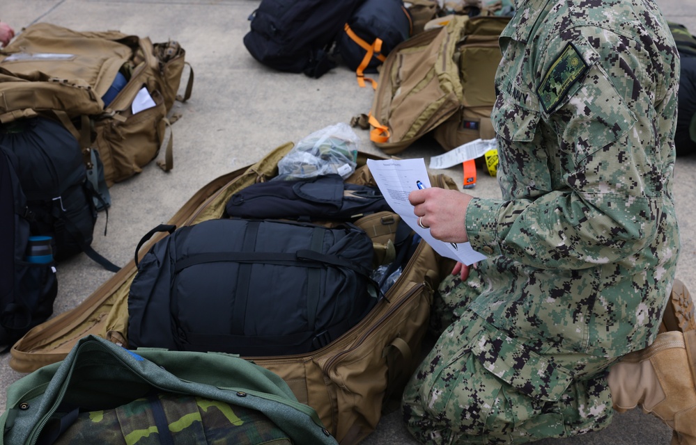 U.S. Navy sailors return deployment gear