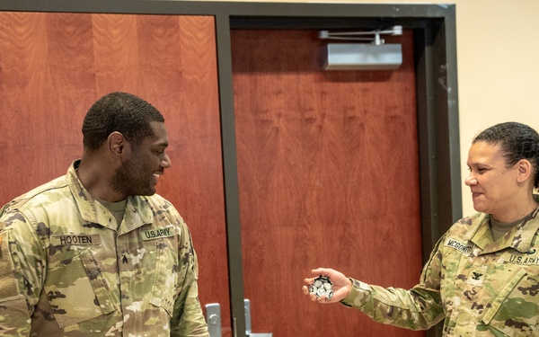 Sgt. Holmes Receives Coin From Col. McGonegal