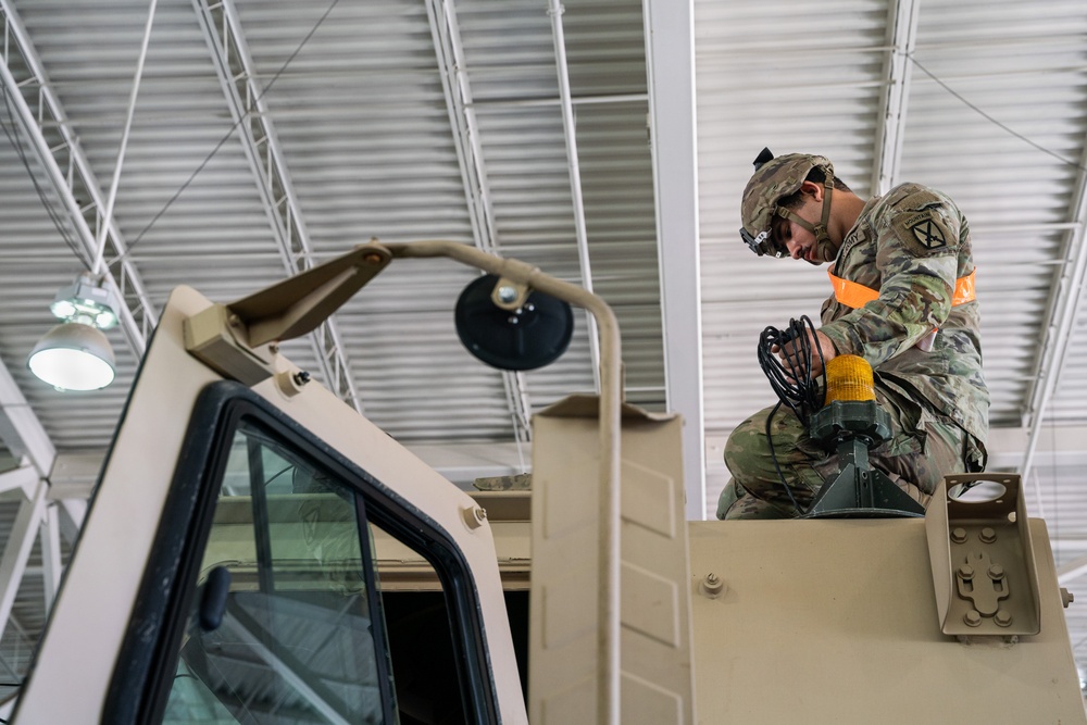 Soldiers with 1st BCT, 10th MTN DIV (LI) install MILES gear at JRTC