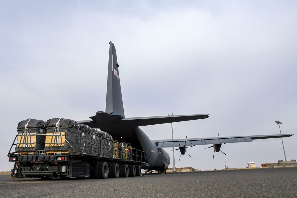 Airmen load AFCENT C-130 with humanitarian aid bound for Gaza