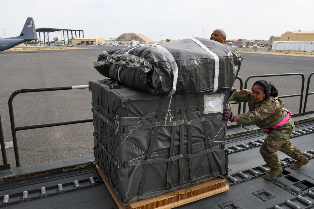 Airmen load AFCENT C-130 with humanitarian aid bound for Gaza