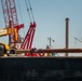 Crews prepare hydraulic wreckage claw during Key Bridge cleanup