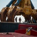 Crews prepare hydraulic wreckage claw during Key Bridge cleanup