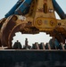 Crews prepare hydraulic wreckage claw during Key Bridge cleanup