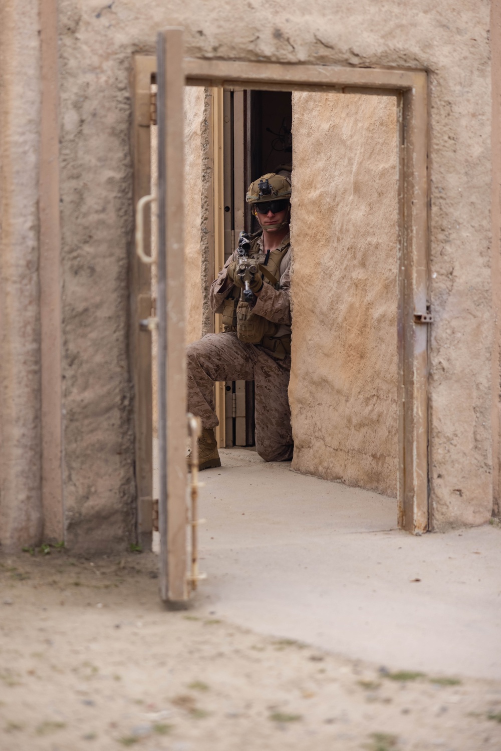 3rd Bn., 4th Marines patrols through infantry immersion trainer