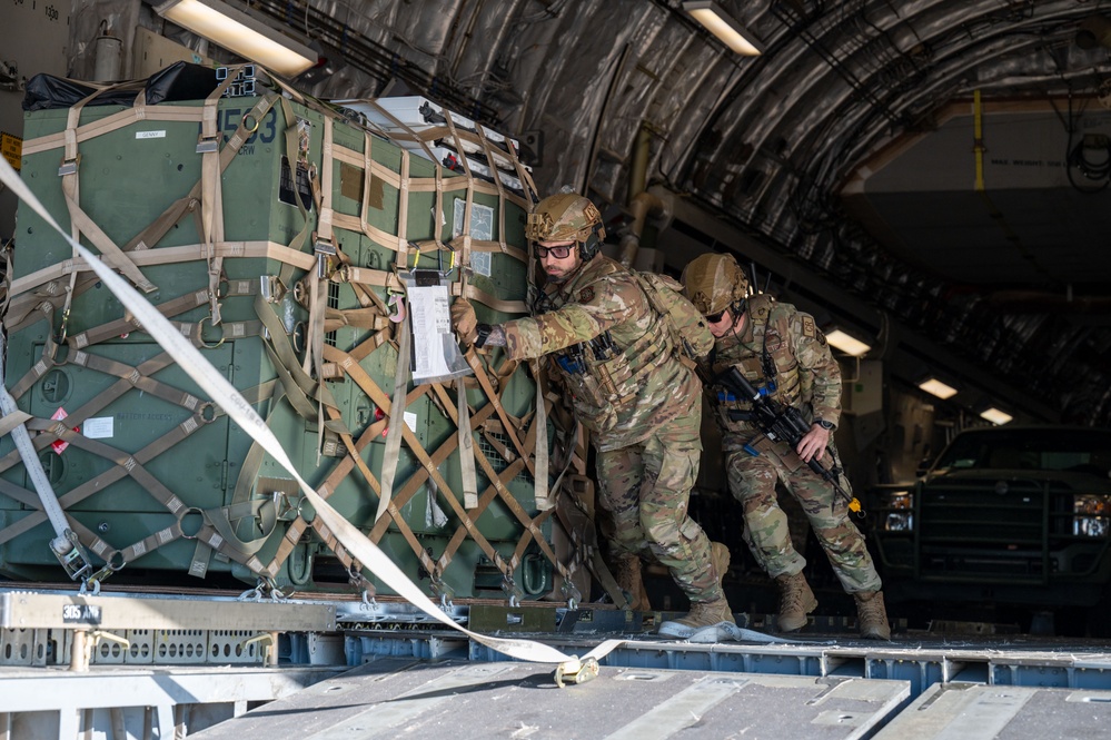 Contingency Response Airmen unload a C-17 during Air Mobility Command's 2024 Spring Industry Preview
