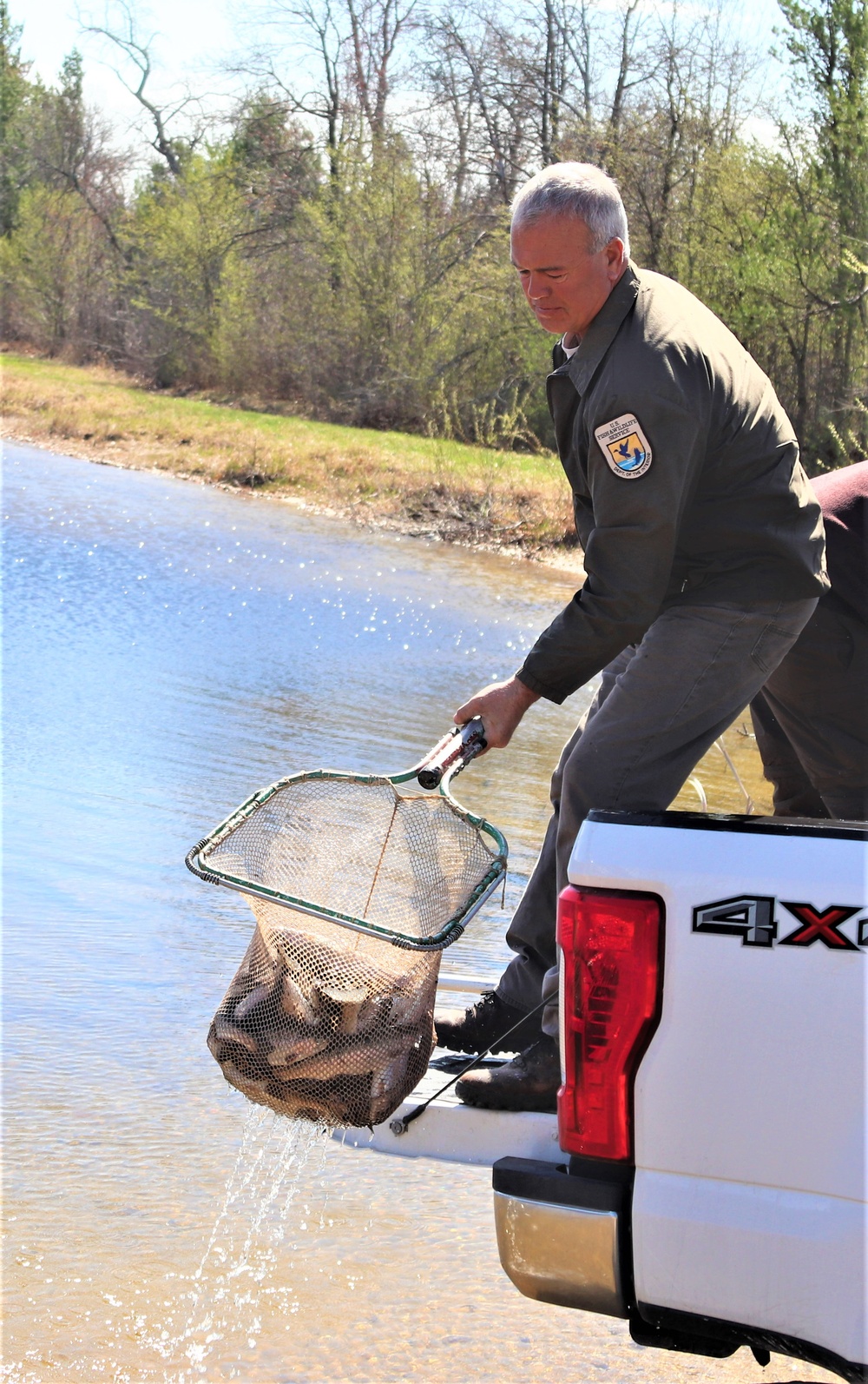 USFWS stocks more than 15,000 rainbow trout in Fort McCoy’s waterways for 2024 fishing season