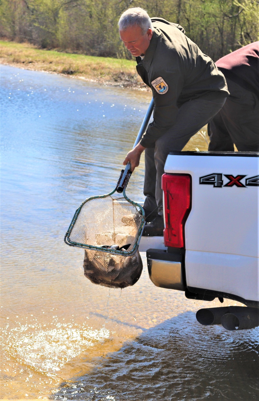 USFWS stocks more than 15,000 rainbow trout in Fort McCoy’s waterways for 2024 fishing season