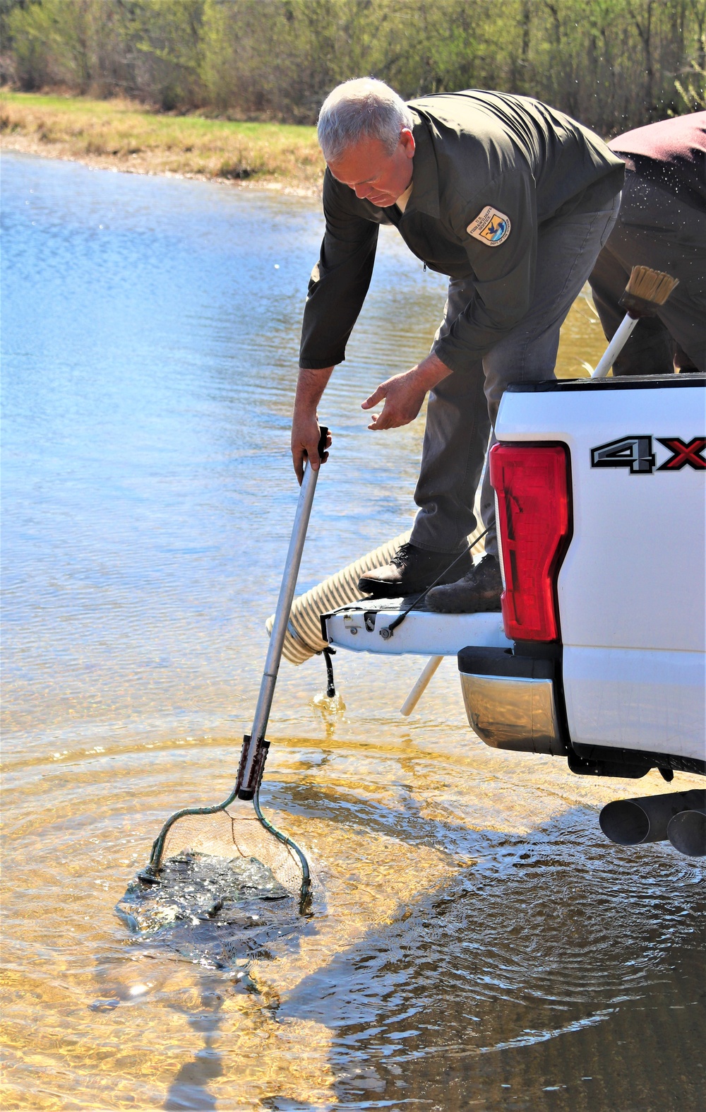 USFWS stocks more than 15,000 rainbow trout in Fort McCoy’s waterways for 2024 fishing season