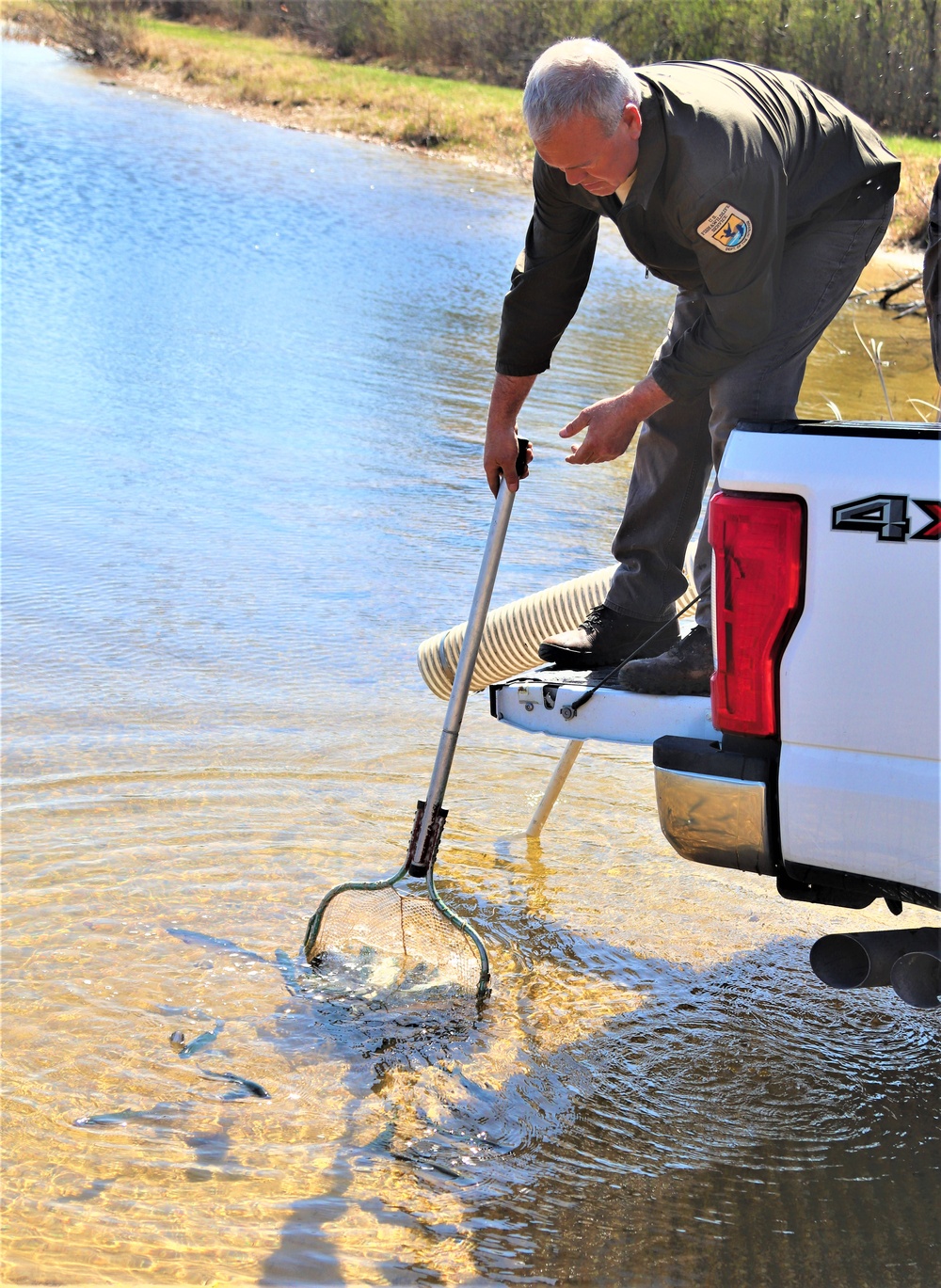 USFWS stocks more than 15,000 rainbow trout in Fort McCoy’s waterways for 2024 fishing season