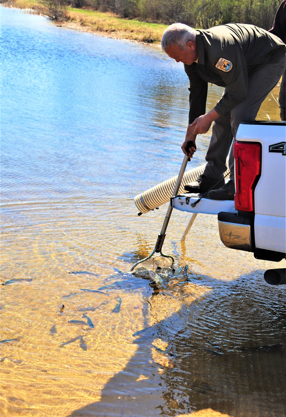 USFWS stocks more than 15,000 rainbow trout in Fort McCoy’s waterways for 2024 fishing season