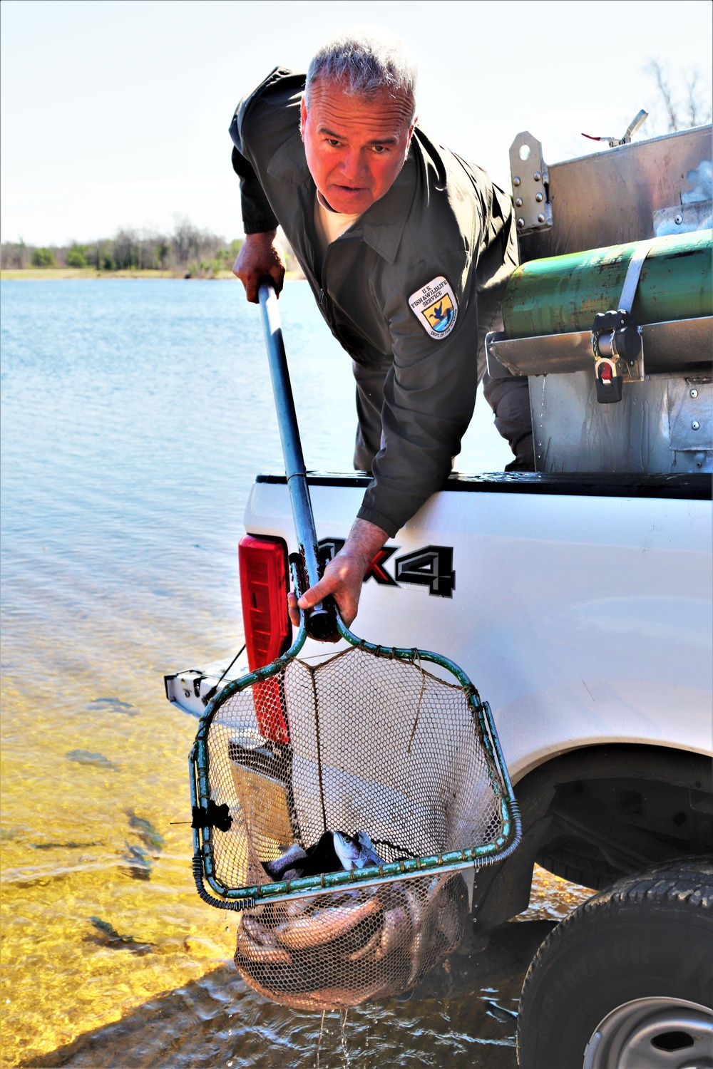 USFWS stocks more than 15,000 rainbow trout in Fort McCoy’s waterways for 2024 fishing season