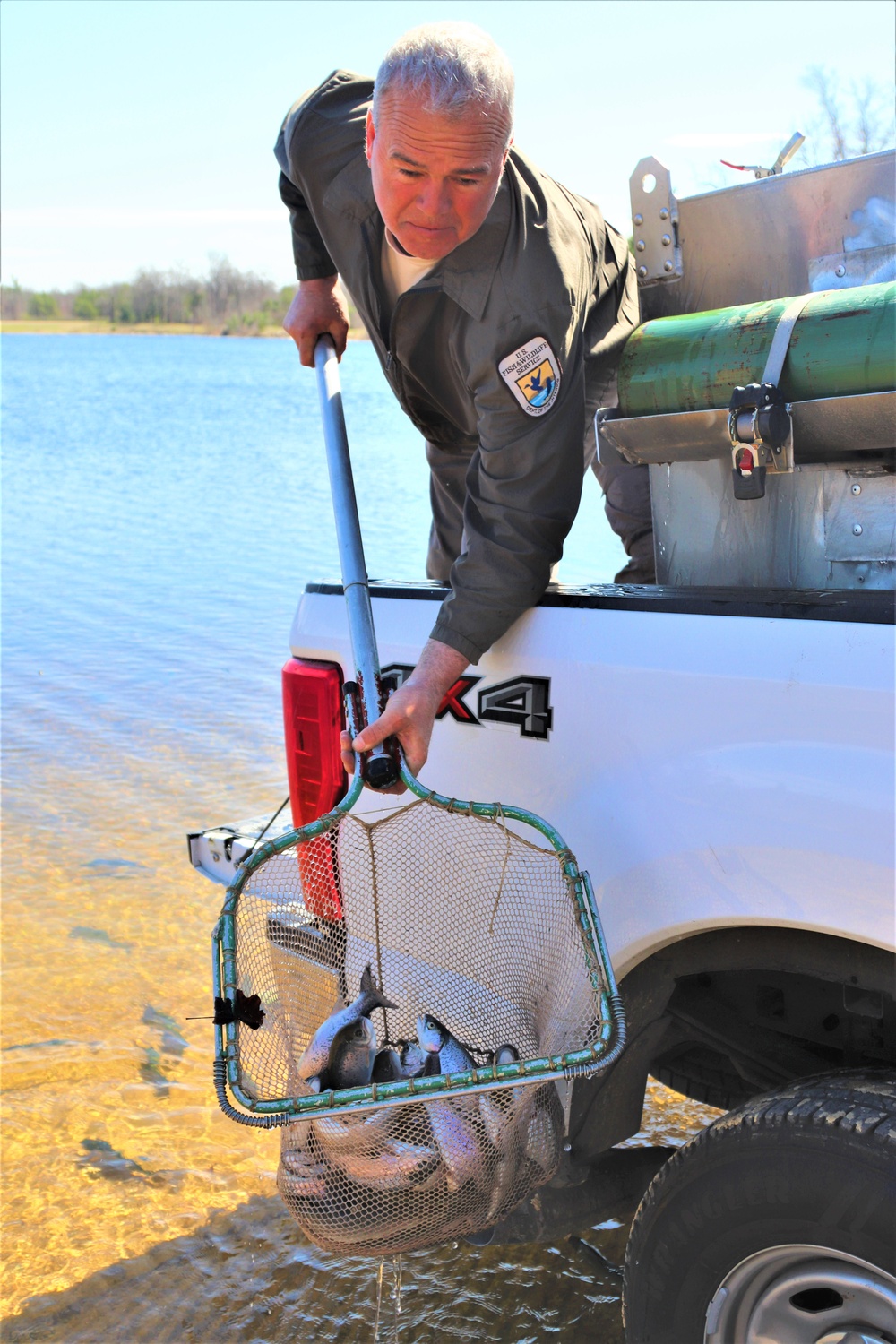 USFWS stocks more than 15,000 rainbow trout in Fort McCoy’s waterways for 2024 fishing season