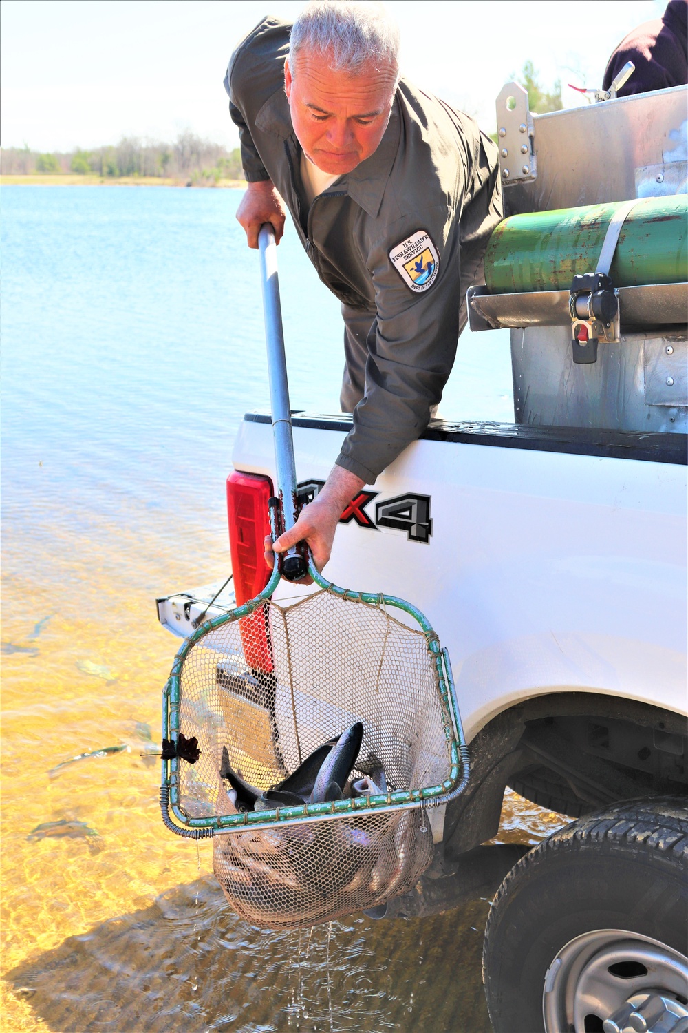 USFWS stocks more than 15,000 rainbow trout in Fort McCoy’s waterways for 2024 fishing season