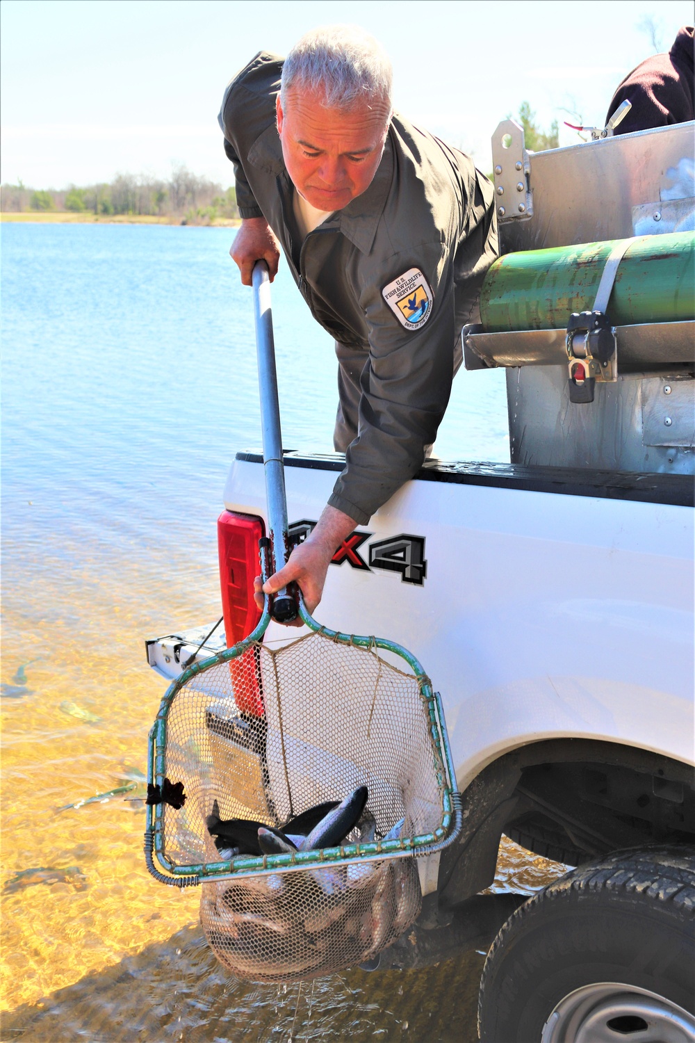 USFWS stocks more than 15,000 rainbow trout in Fort McCoy’s waterways for 2024 fishing season