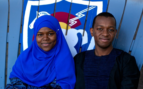 10th SFG(A) Soldier sits with his wife after reuniting