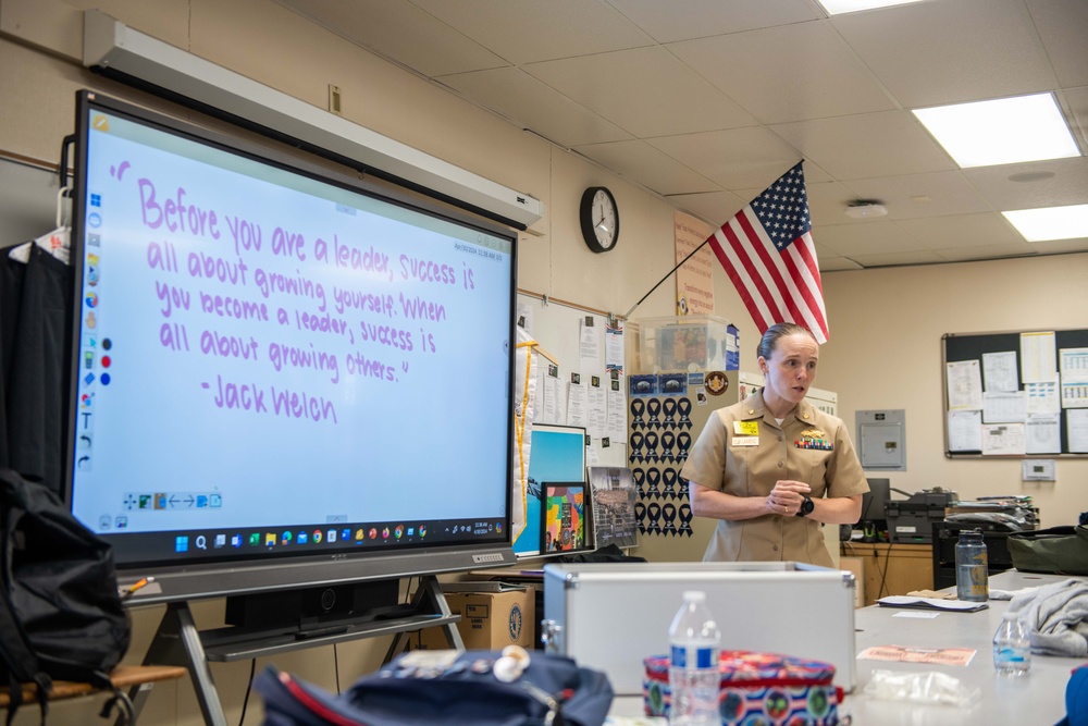 Lt. Cmdr. Lawrenz speaks with JROTC students at John F. Kennedy High School