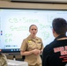 Lt. Cmdr. Lawrenz listens to a question from JROTC students at John F. Kennedy High School