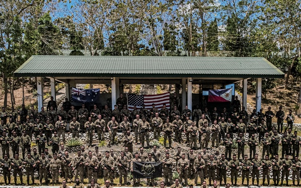 Balikatan 24: Alpha Company, 2nd Battalion, 27th Infantry Regiment, 3rd Infantry Brigade Combat Team, 25th Infantry Division take group photos with 1st Battalion, 77th Infantry Battalion, 5th Infantry Division