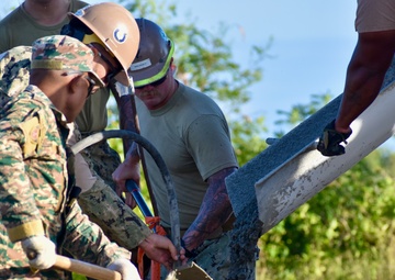 NMCB 4 Seabees and Timor-Leste Defense Force Engineers Lay Warehouse Foundation