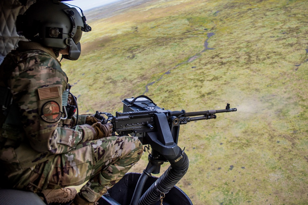 Airmen conduct aerial gunnery training from UH-1N Hueys over Idaho's OCTC ranges