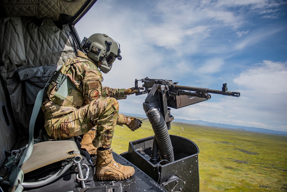 Airmen conduct aerial gunnery training from UH-1N Hueys over Idaho's OCTC ranges