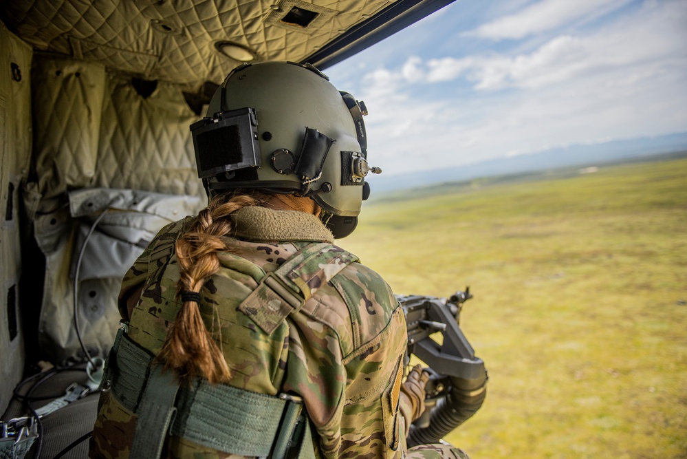 Airmen conduct aerial gunnery training from UH-1N Hueys over Idaho's OCTC ranges