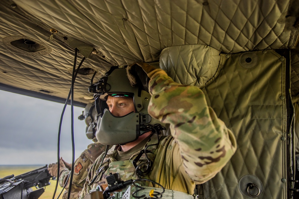 Airmen conduct aerial gunnery training from UH-1N Hueys over Idaho's OCTC ranges