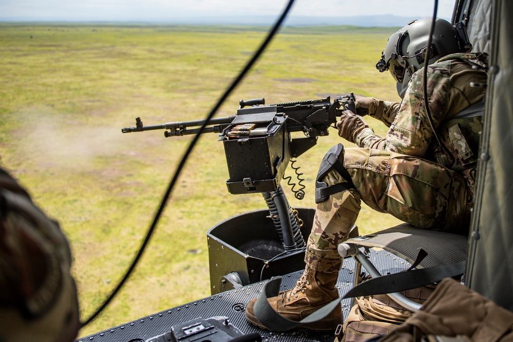 Airmen conduct aerial gunnery training from UH-1N Hueys over Idaho's OCTC ranges