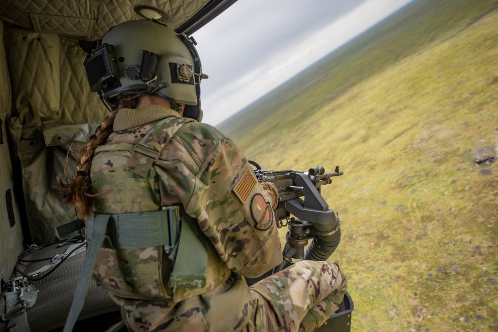 Airmen conduct aerial gunnery training from UH-1N Hueys over Idaho's OCTC ranges