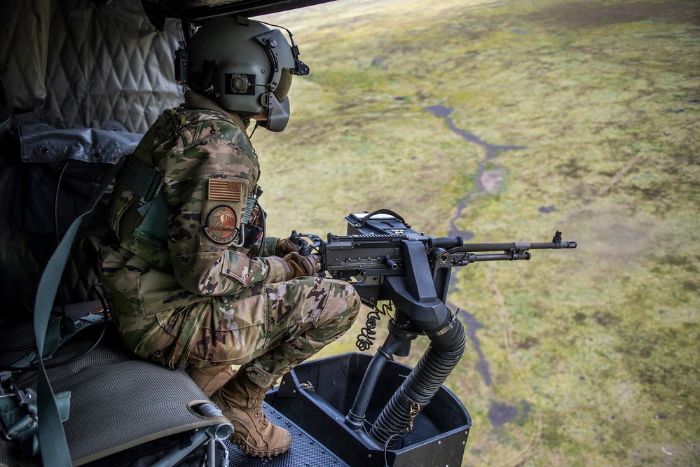 Airmen conduct aerial gunnery training from UH-1N Hueys over Idaho's OCTC ranges