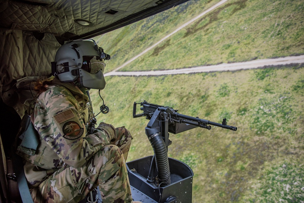 Airmen conduct aerial gunnery training from UH-1N Hueys over Idaho's OCTC ranges