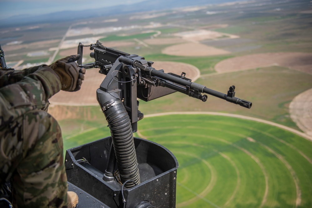 Airmen conduct aerial gunnery training from UH-1N Hueys over Idaho's OCTC ranges