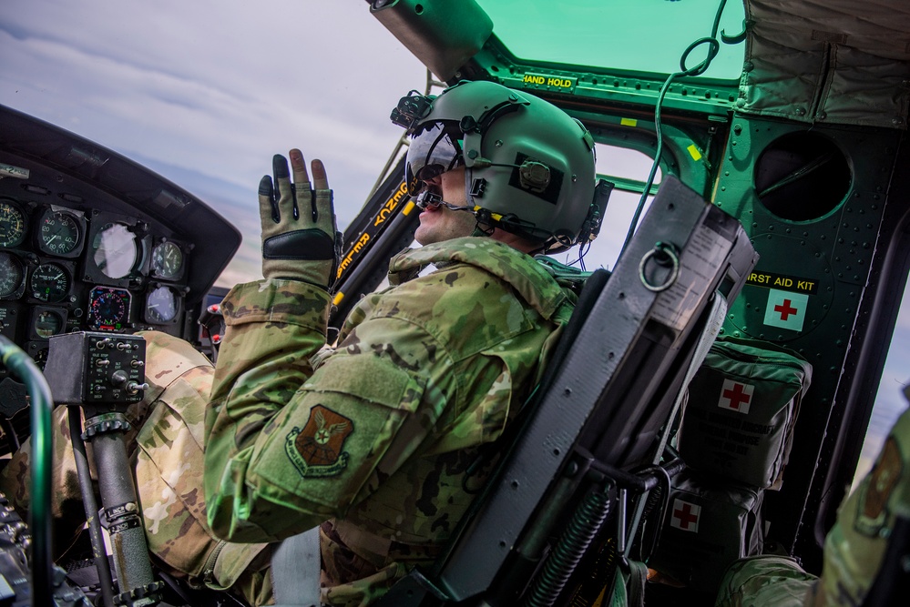 Airmen conduct aerial gunnery training from UH-1N Hueys over Idaho's OCTC ranges