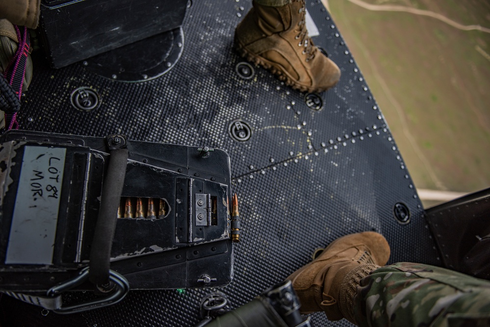 Airmen conduct aerial gunnery training from UH-1N Hueys over Idaho's OCTC ranges