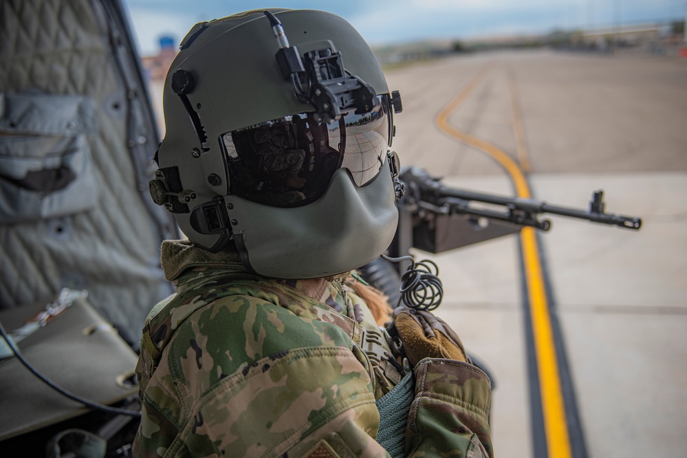 Airmen conduct aerial gunnery training from UH-1N Hueys over Idaho's OCTC ranges