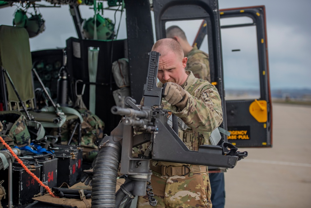 Airmen conduct aerial gunnery training from UH-1N Hueys over Idaho's OCTC ranges