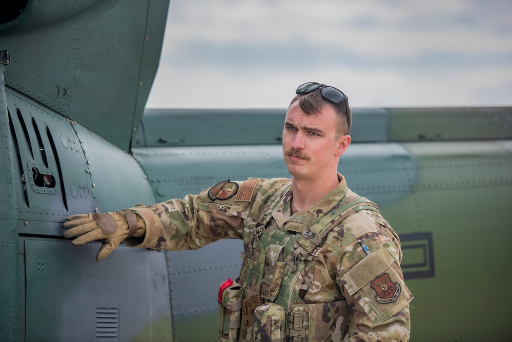 Airmen conduct aerial gunnery training from UH-1N Hueys over Idaho's OCTC ranges