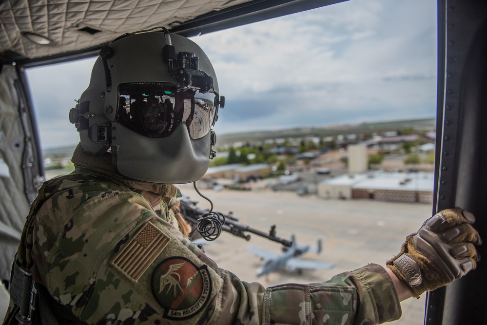 Airmen conduct aerial gunnery training from UH-1N Hueys over Idaho's OCTC ranges