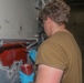 Sailors aboard the USS Howard apply primer to the ship's bulkhead in the South China Sea