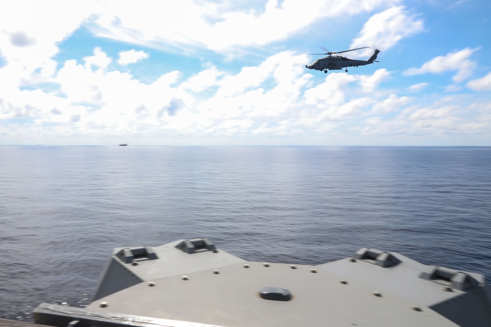 Sailors aboard the USS Howard conduct flight quarters in the South China Sea